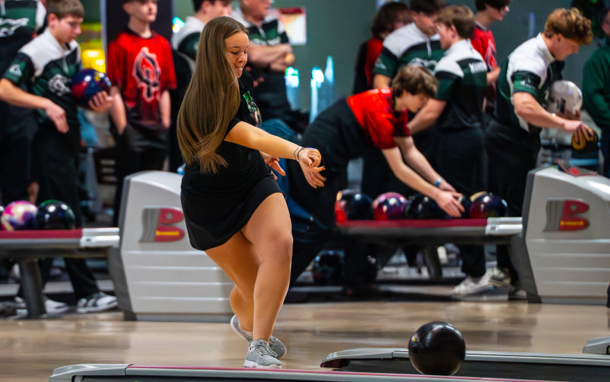 Girl after releasing bowling ball